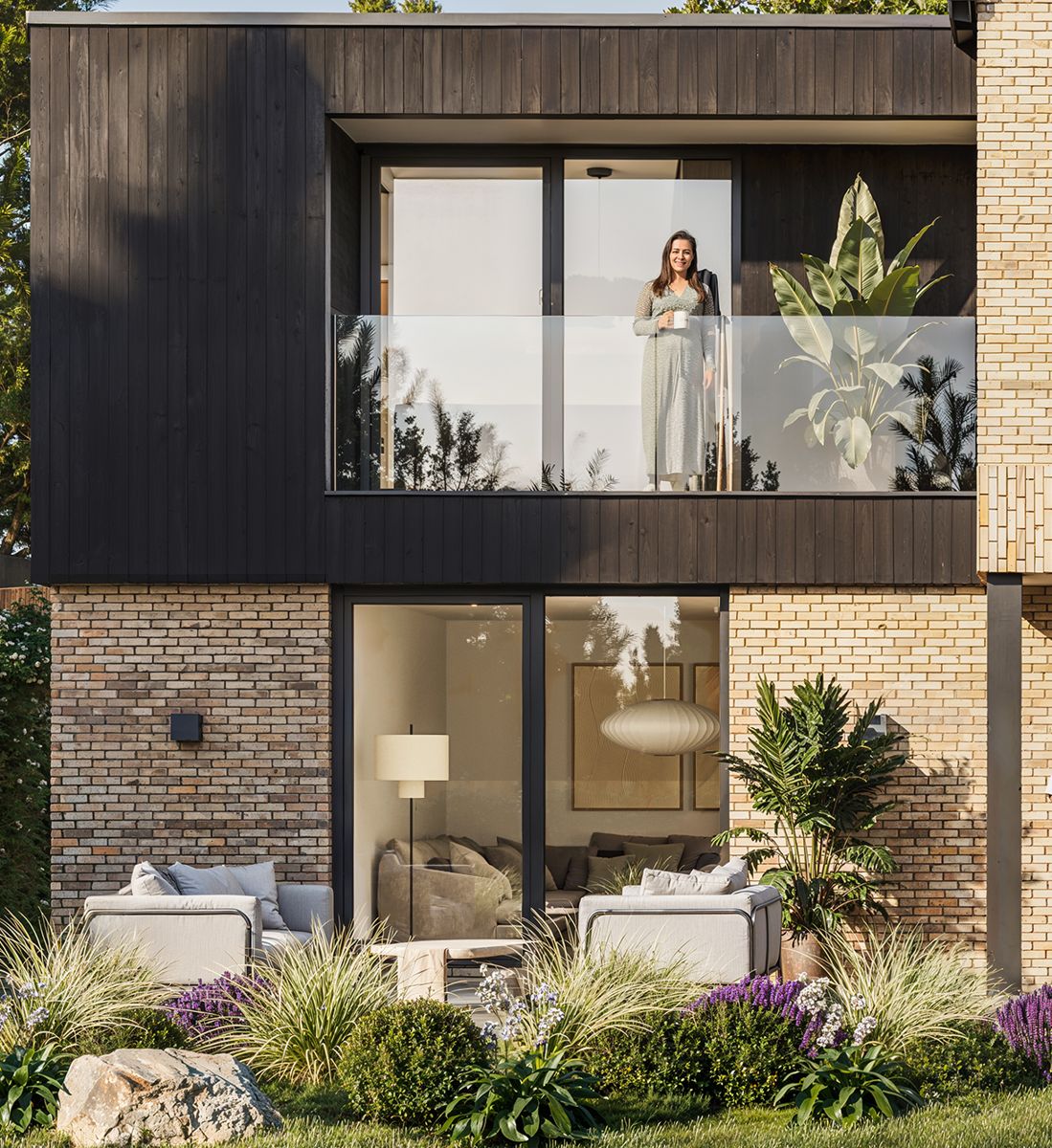 Balcony and garden terrace in dark boarding and brick