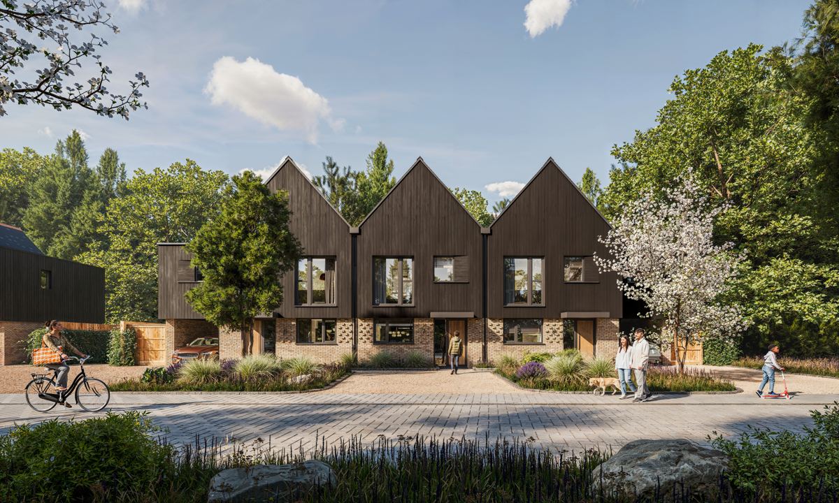 A row of gable-fronted terraced homes in dark vertical boarding over a buff brick base